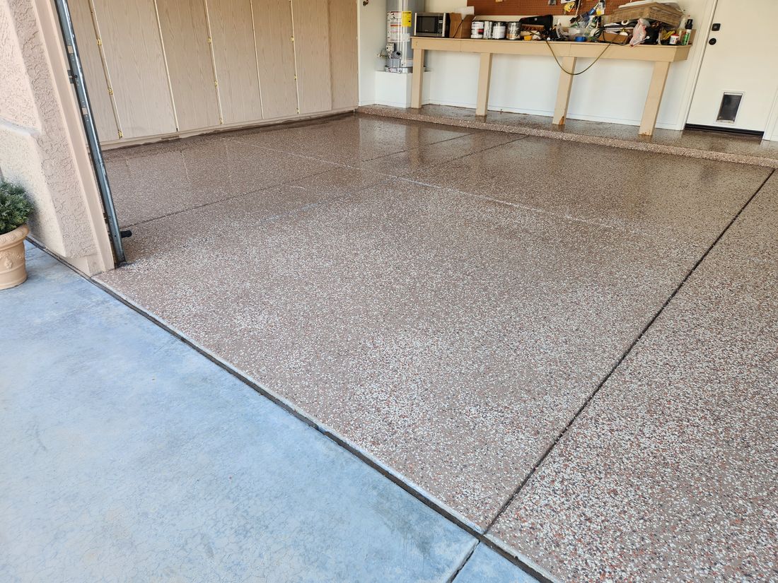 Epoxy-coated garage floor by Ready & Abel LLC