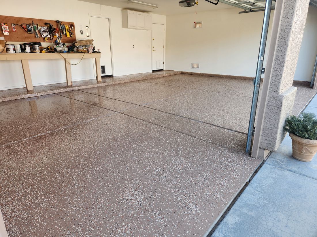 Epoxy-coated garage floor by Ready & Abel LLC